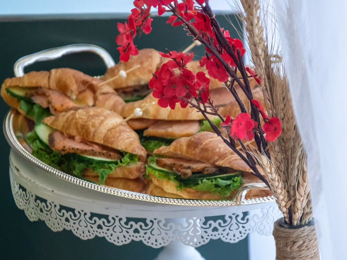 Croissant sandwiches on a silver tray